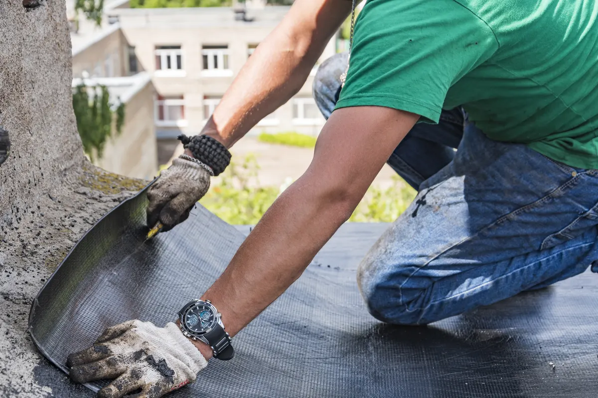 Crack in a concrete slab being cleaned and filled